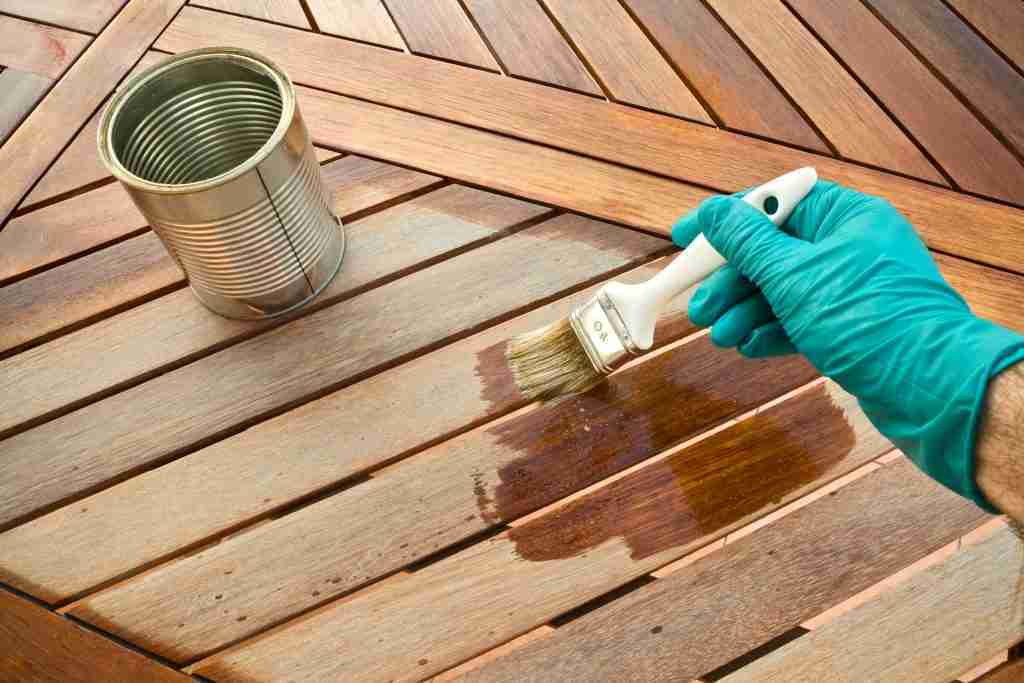 Oil being applied to lumber